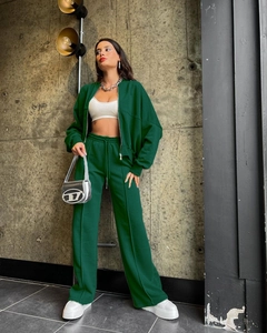 Detail of dark green tracksuit set featuring cropped zip hoodie and wide-leg sweatpants