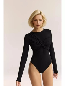 Detail of a black long-sleeve bodysuit featuring a unique twist front design and slim fit