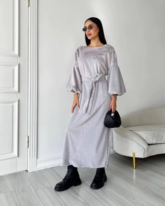 Detail of grey plush maxi dress featuring lantern sleeves and a drawstring waist tie