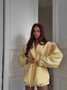 Pale yellow structured blazer with padded shoulders and drawstring waist for women