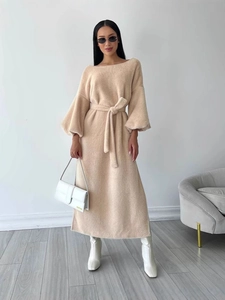 Elegant apricot knit maxi dress featuring lantern sleeves and waist tie for a sleek fit