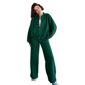 Women's dark green two-piece zip-up hoodie and high-waist wide-leg pants set
