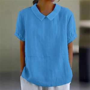 Detail of short sleeves with pleated cuffs and collar on loose blue shirt