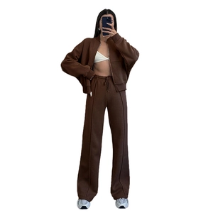 Women's dark brown two-piece tracksuit featuring a zip-up jacket and wide-leg sweatpants