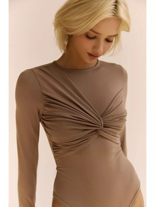 Detail showing the elegant front twist knot design on the mocha long sleeve bodysuit