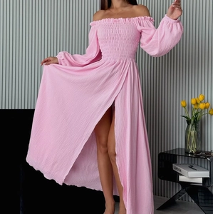 Detail of pink off-shoulder dress with elastic smocking and pleated lantern sleeves