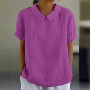 Detail of a bright purple short sleeve blouse featuring a Peter Pan collar and cotton linen texture