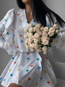 Short puff sleeve shirt with colorful heart pattern and ruffled trim for women