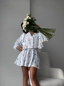 White two-piece heart print crop top and mini skirt set with ruffle puff sleeves