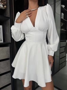 Elegant white V-neck puff sleeve dress with high waist A-line skirt for a modern chic style