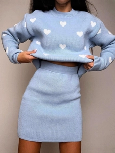 Light blue knit two-piece set featuring long sleeve heart pattern sweater and mini skirt