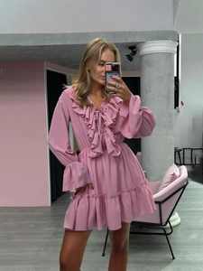 Pink V-neck mini dress with ruffled layers and bell sleeves in a feminine sweet style