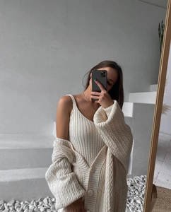 Detailed knit texture of cream white cardigan set with cable knit and rib stitch details