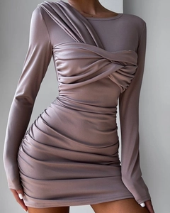 Detail showing the intricate criss-cross bodice and pleated ruching on the mauve dress