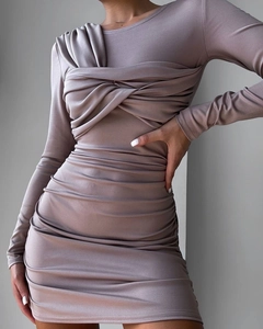 Detailed view of the ruching and knot design on this slim-fit mauve long sleeve dress