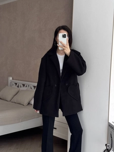 Women's black wool blazer coat with unique heart-shaped pockets and elegant lapel design