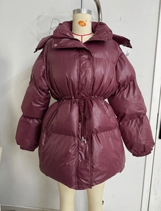 Detailed view of wine red puffer jacket featuring adjustable waist drawstring and hood