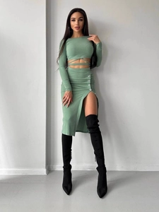 Chic sage green two-piece knit set with long sleeve crop top and side slit midi skirt