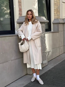 Elegant off-white long wool coat with large lapels and V-neck tie belt for women