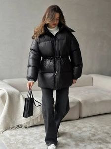 Women's black hooded puffer jacket with drawstring waist and windproof finish