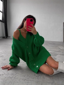 Vibrant green two-piece knit set featuring a cable-knit cardigan and matching tank top