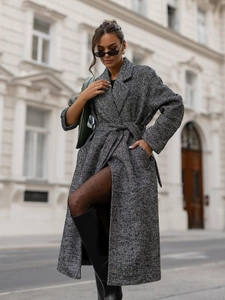 Close-up of the grey herringbone wool coat featuring a classic lapel and matching waist belt