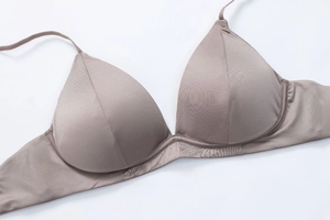 Detail of coffee brown seamless triangle cup bra with silky stretch fabric and slim straps