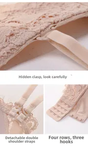 Detail view of pink lace bra featuring detachable straps and four-row hook-and-eye closure