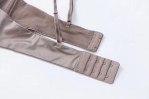 Detail view of seamless bra back closure with four-row hooks and adjustable straps