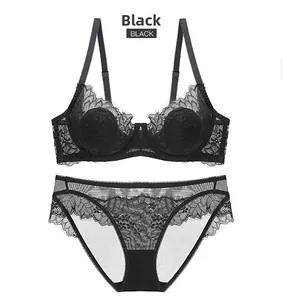Detailed view of black French lace lingerie set with eyelash trim and sheer floral patterns