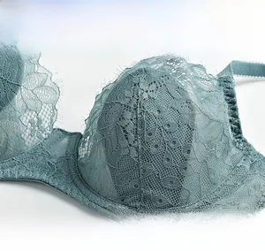 Detail of teal floral embroidery lace and eyelash trim on French style sheer bra