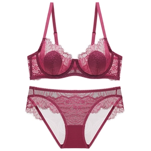 Deep rose red lace lingerie set with underwire bra and matching mesh panties on white