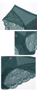 Close-up of dark green lace panties with red cherry embroidery and scalloped edges