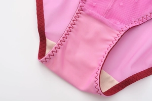 Detail of breathable pink heart mesh and cotton crotch with zigzag stitching on panties