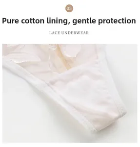 Close-up of breathable cotton crotch detail on white lace floral embroidery thong