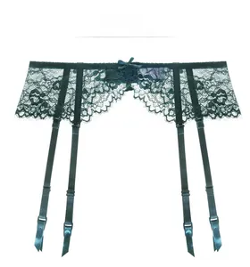 Detail of dark green floral eyelash lace garter belt with adjustable straps and bows