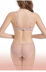 Rear view of pink lace lingerie set featuring thin adjustable straps and sheer mesh panties