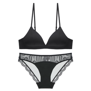 Detail view of black minimalist triangle bralette set with delicate lace trim edges
