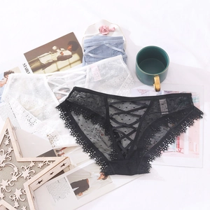 Set di biancheria intima in pizzo a pois con lacci laterali in nero, bianco e azzurro