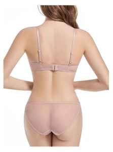Detail view of seamless mesh lingerie set with back hook-and-eye closure in nude pink
