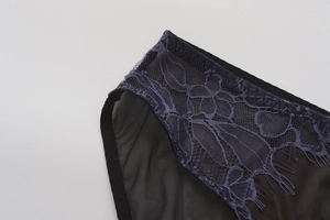 Detailed macro view of black lace lingerie showing intricate floral mesh and eyelash trim