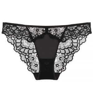 Detail of black floral lace fabric and smooth satin center panel on women underwear