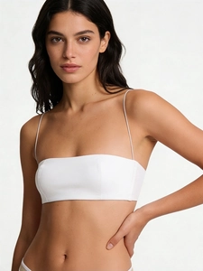 Detail of white French style bralette featuring ultra-thin straps and seamless fabric