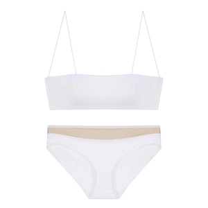 Detailed view of white wireless bralette set with thin straps and sheer mesh trim accents