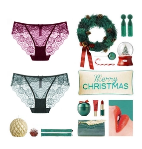 Lace lingerie set in burgundy and dark green colors with festive Christmas decorations