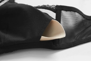 Detail of detachable breathable nude pad inside black mesh French triangle cup bra