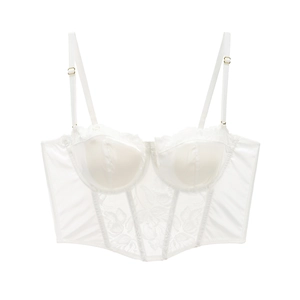 Dettaglio ravvicinato del corsetto in raso bianco con pizzo floreale e stecche di supporto