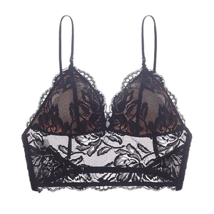 Detailed view of delicate black floral lace embroidery on a wire-free triangle bra