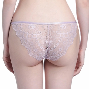 Detailed view of lavender lace floral embroidery with delicate eyelash trim on panties