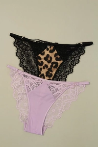 Detail of lace panties with leopard print and purple silk fabric featuring gold rings